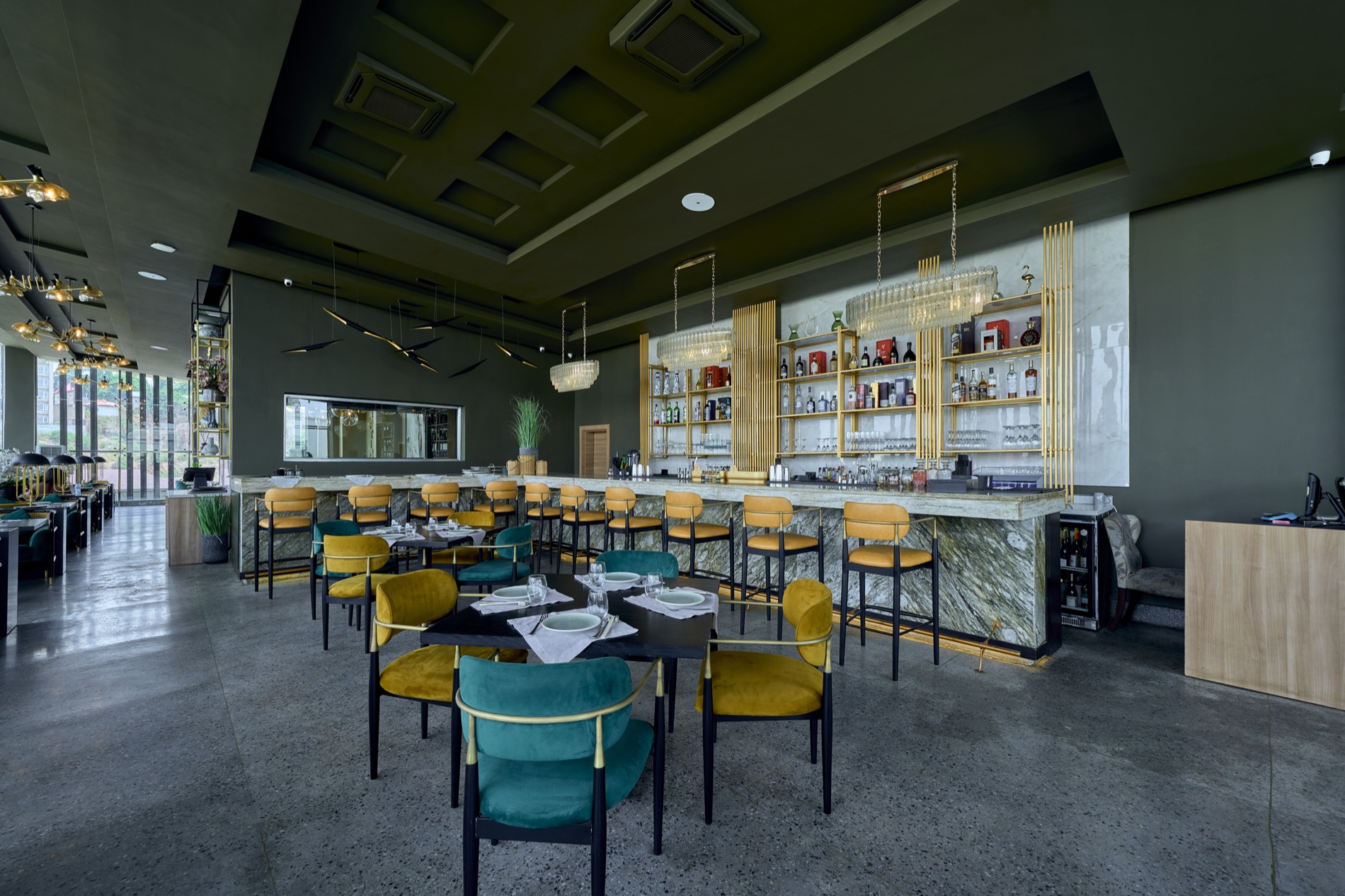 The Marks at the Park dining room and marble bar, with brass detailing and velvet seating